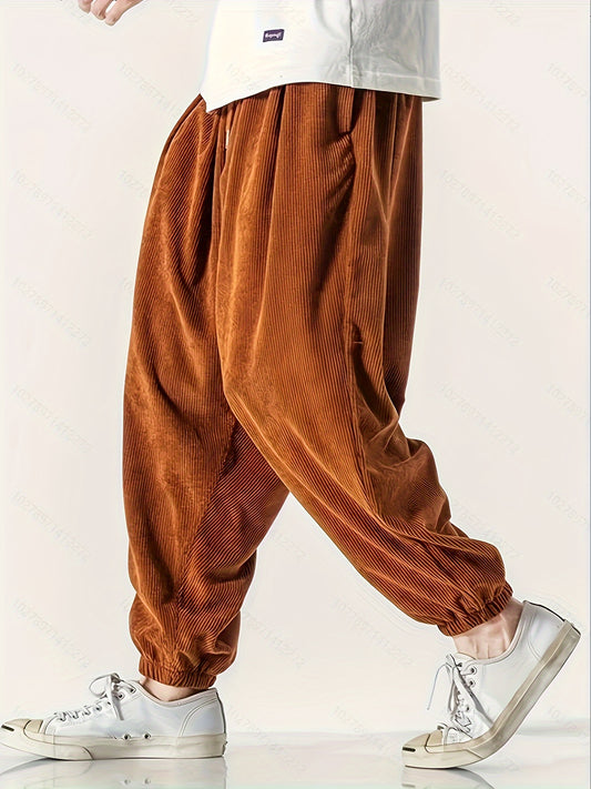 Men's wide leg corduroy pants with drawstring, chic and comfy for spring and fall.