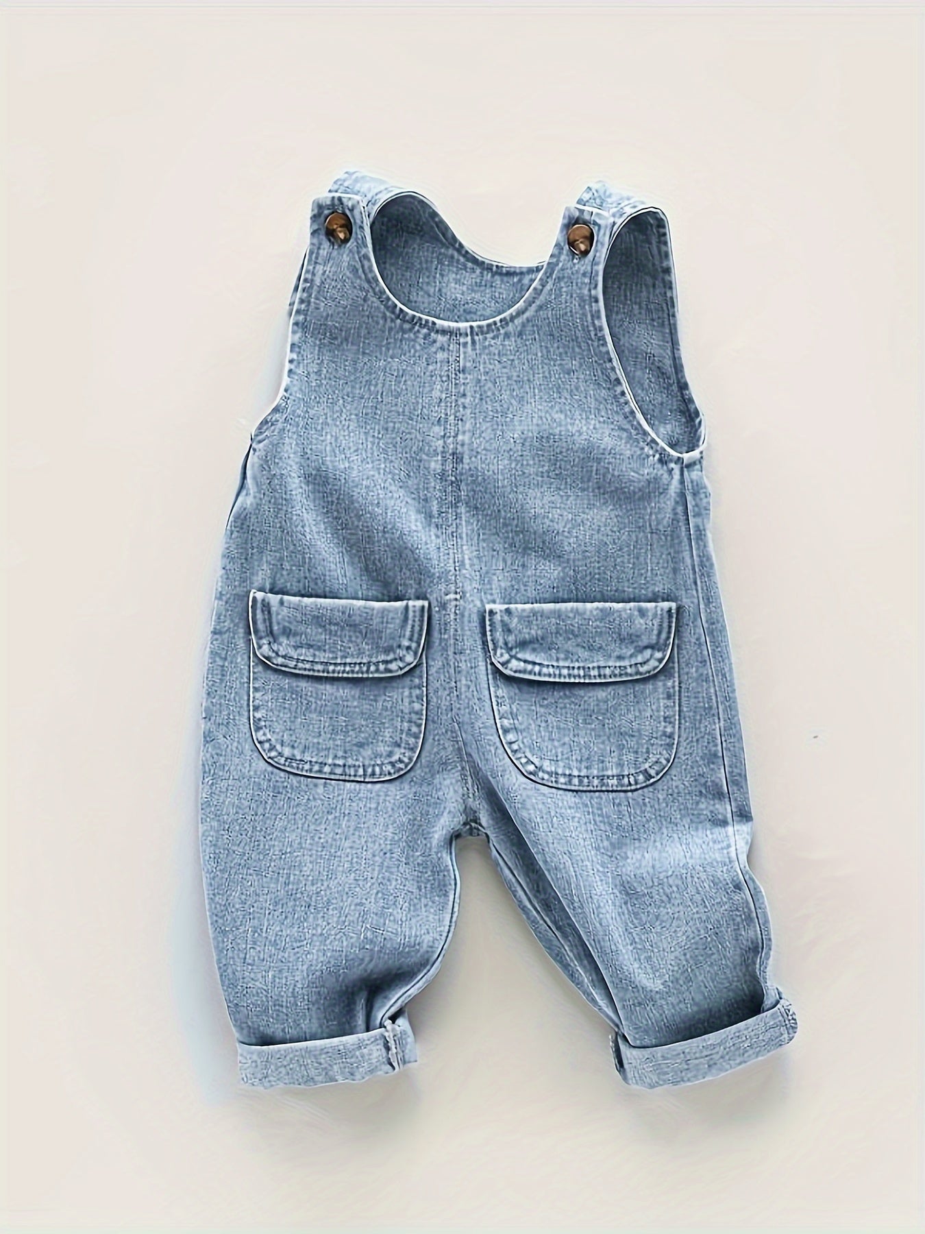 Light blue denim overalls for toddler boys with adjustable straps, pockets, and non-stretch fabric. Ideal for spring/fall and outdoor activities.