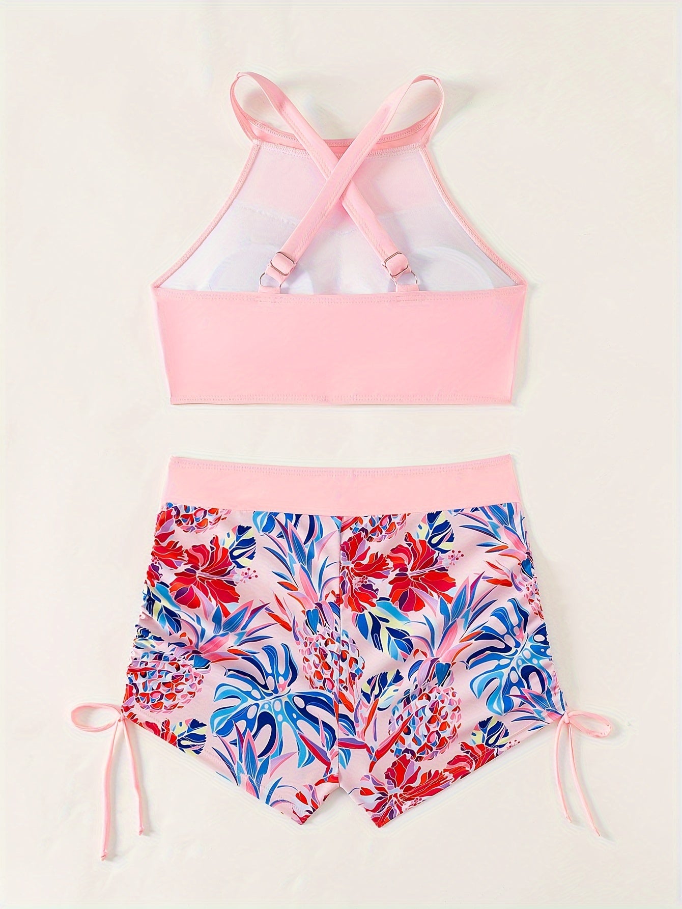 Conservative women's two-piece swimsuit with high-waisted shorts and ring-linked top for beach and hot spring wear.