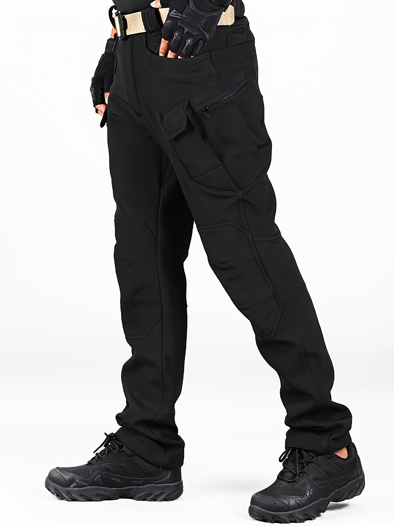 Men's fleece lined cargo pants for outdoor activities in fall/winter, with multiple pockets and windproof/waterproof features.