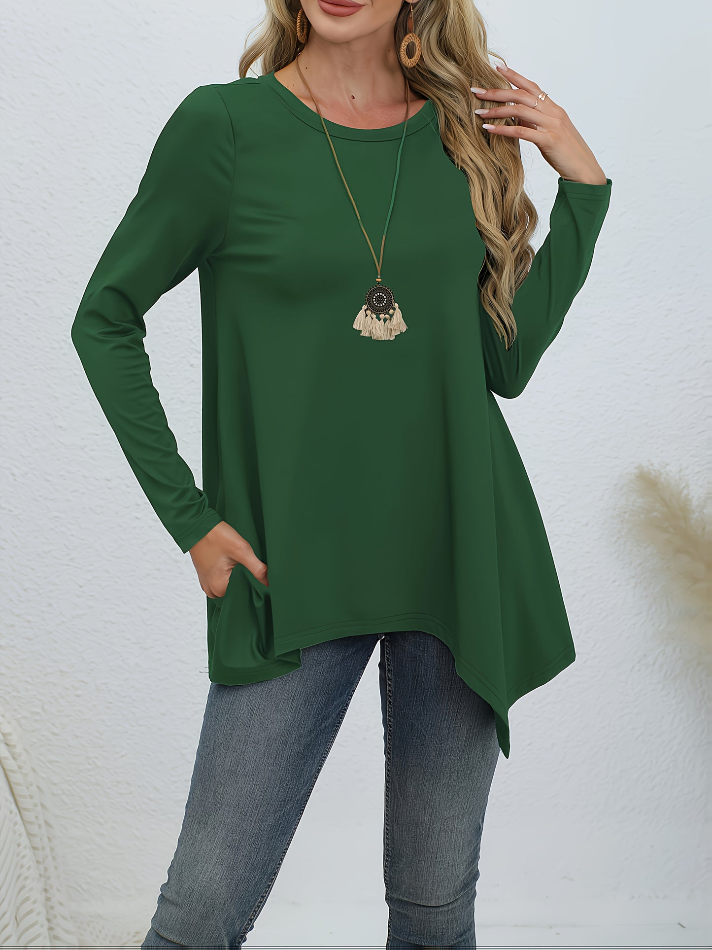 Comfortable lounge tops for women, including round neck long sleeve tunic with asymmetric hem.