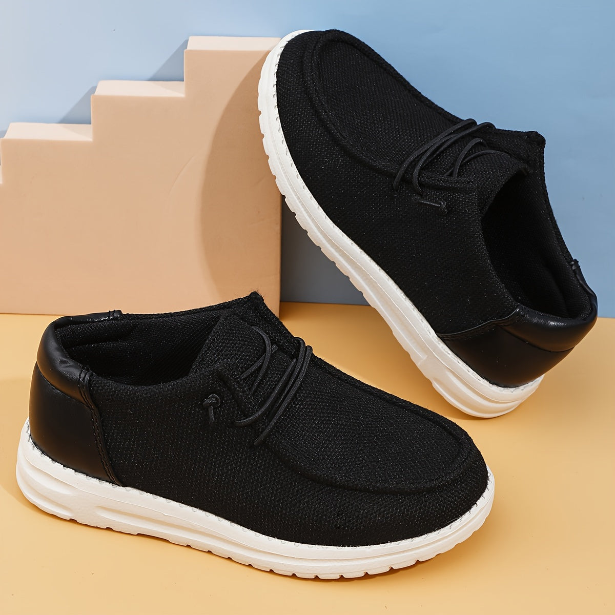 Boys' casual, comfortable canvas shoes in solid colors, ideal for all seasons.