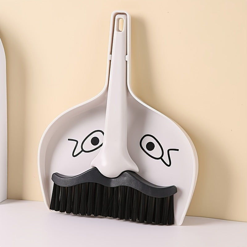 Portable handheld cleaning brush and dustpan set, perfect for any surface such as desks, pet cages, sofas, furniture, window crevices, and ideal for travel and camping. Made of durable ABS material, no electricity required. Includes a mini duster and