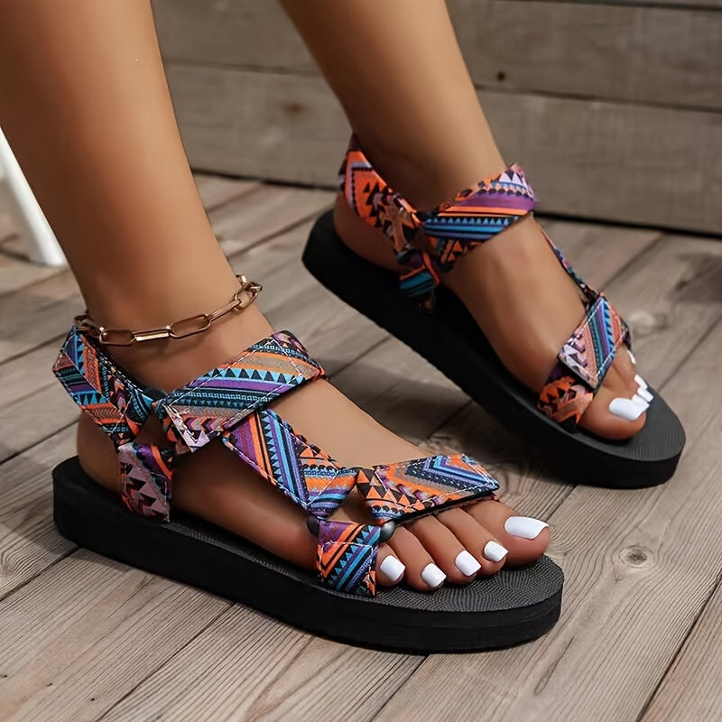 Flat sandals with tribal pattern, open toe and lightweight design for casual summer wear.