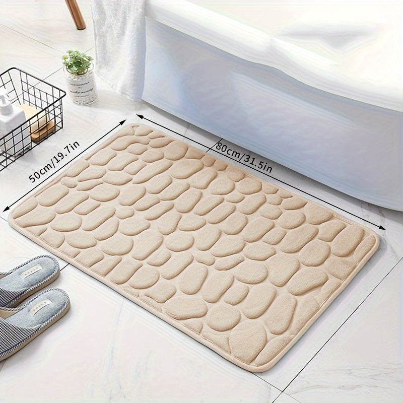 Soft, non-slip coral fleece bathroom mat in a pebble pattern. Quick-dry, machine washable, and low pile for comfort and home decor. Made of plush polyester fiber with knit fabric and 100% polyester material. 570gsm and 1.4cm thick.