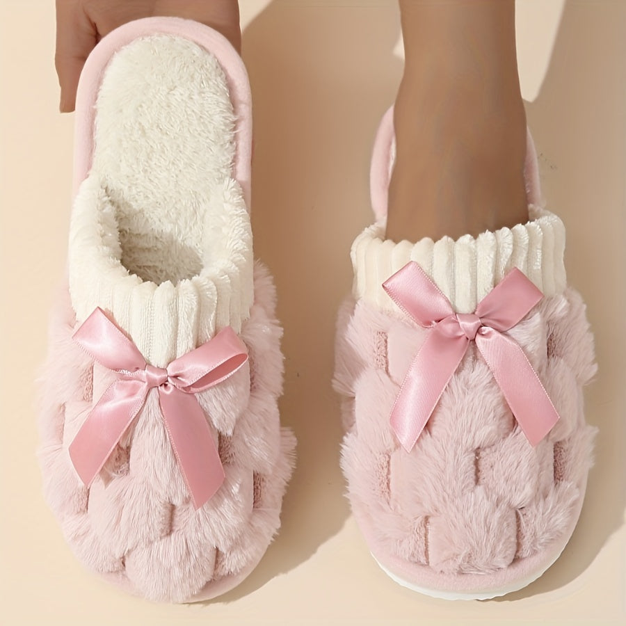 Winter plush cozy non-slip shoes with soft sole and flat bowknot decoration, ideal for home warmth.