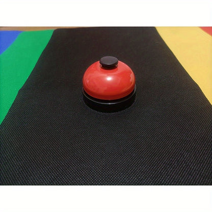 Colorful metal hand-press training bell for dogs & cats with red, yellow, & green bells on black background. Durable & easy-to-use pet trainer.