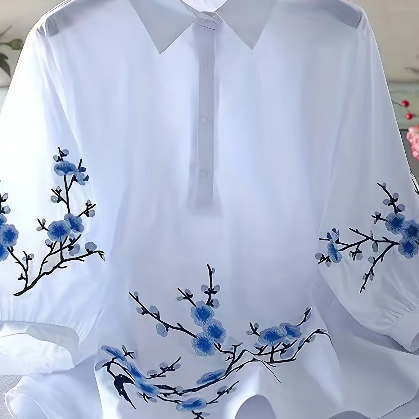 White floral embroidered shirt for women, made of polyester woven fabric with detailed embroidery and a collar design. Perfect for adult vacation style in spring/summer/autumn.