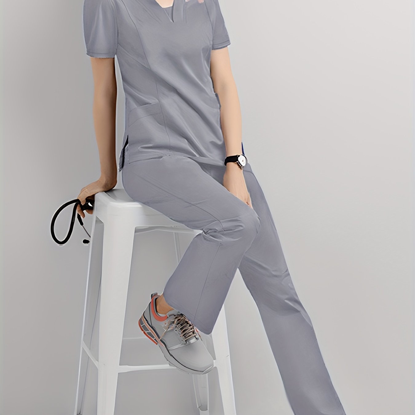 Durable Women's Jogger Scrub Set with V-Neck Top, Drawstring Pants, and Functional Pockets - Ideal for Healthcare Professionals. Made with Stretchy & Breathable Polyester/Spandex, Machine