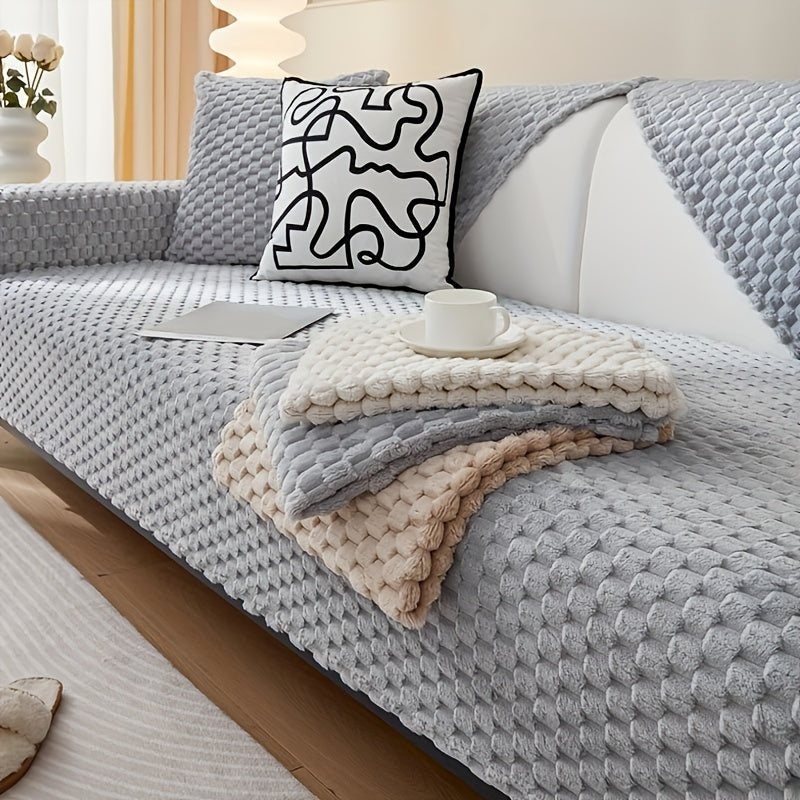 Non-slip sofa cover with honeycomb pattern, ideal for all seasons and protecting furniture in any room.