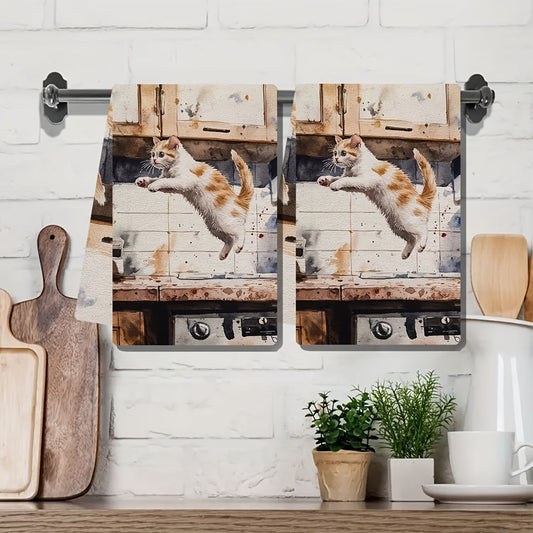 Two pieces of incredibly soft kitchen towels featuring a playful kitten leaping design. These highly absorbent and machine washable dish hand towels are perfect for your contemporary style kitchen. Each towel measures 40.64x60.96 cm and is ideal for