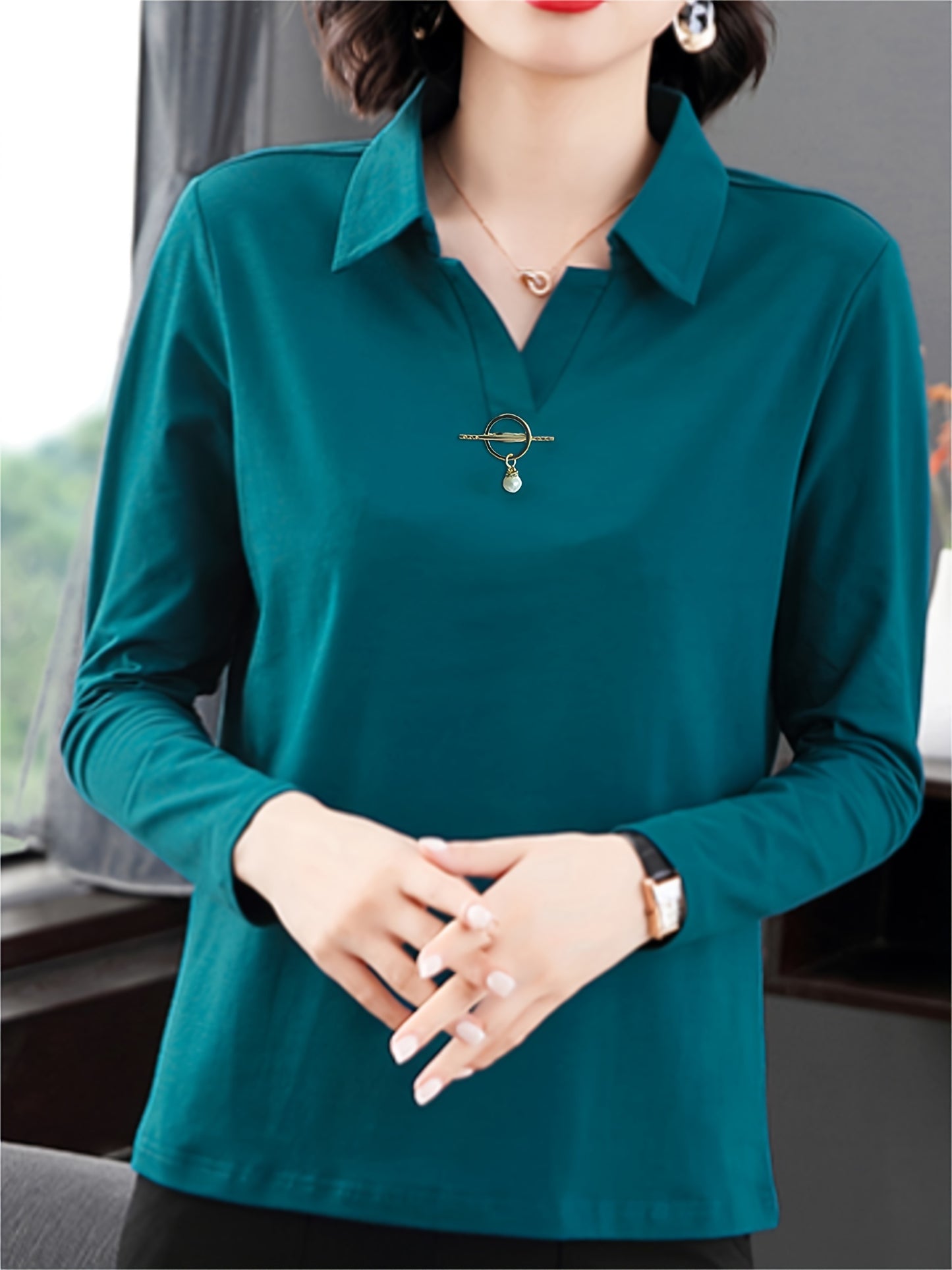 Solid color collared T-shirt for women, good for spring and fall seasons.