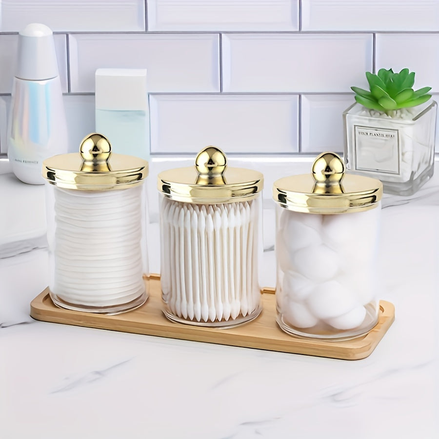 3-piece Qtip holder with tray, acrylic apothecary jars and lids for bathroom storage.