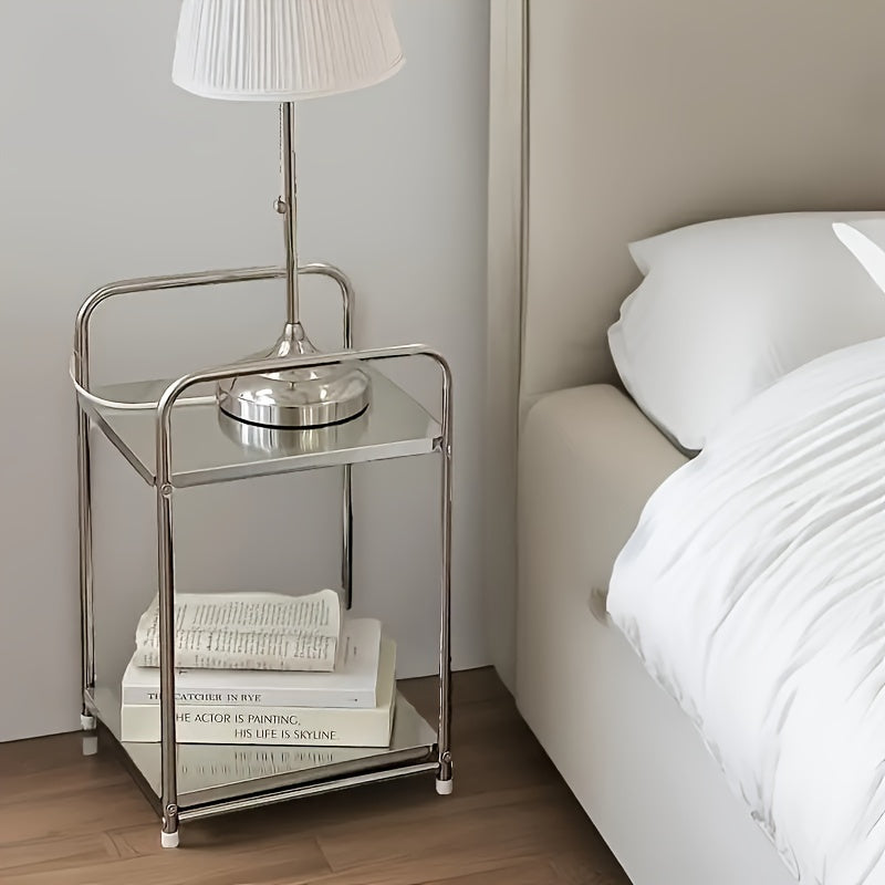 This modern stainless steel utility rack has two tiers and can be used for multiple functions. It does not require any assembly and can be used as a side sofa table or bedside organizer stand. It can be used without the need for electricity.