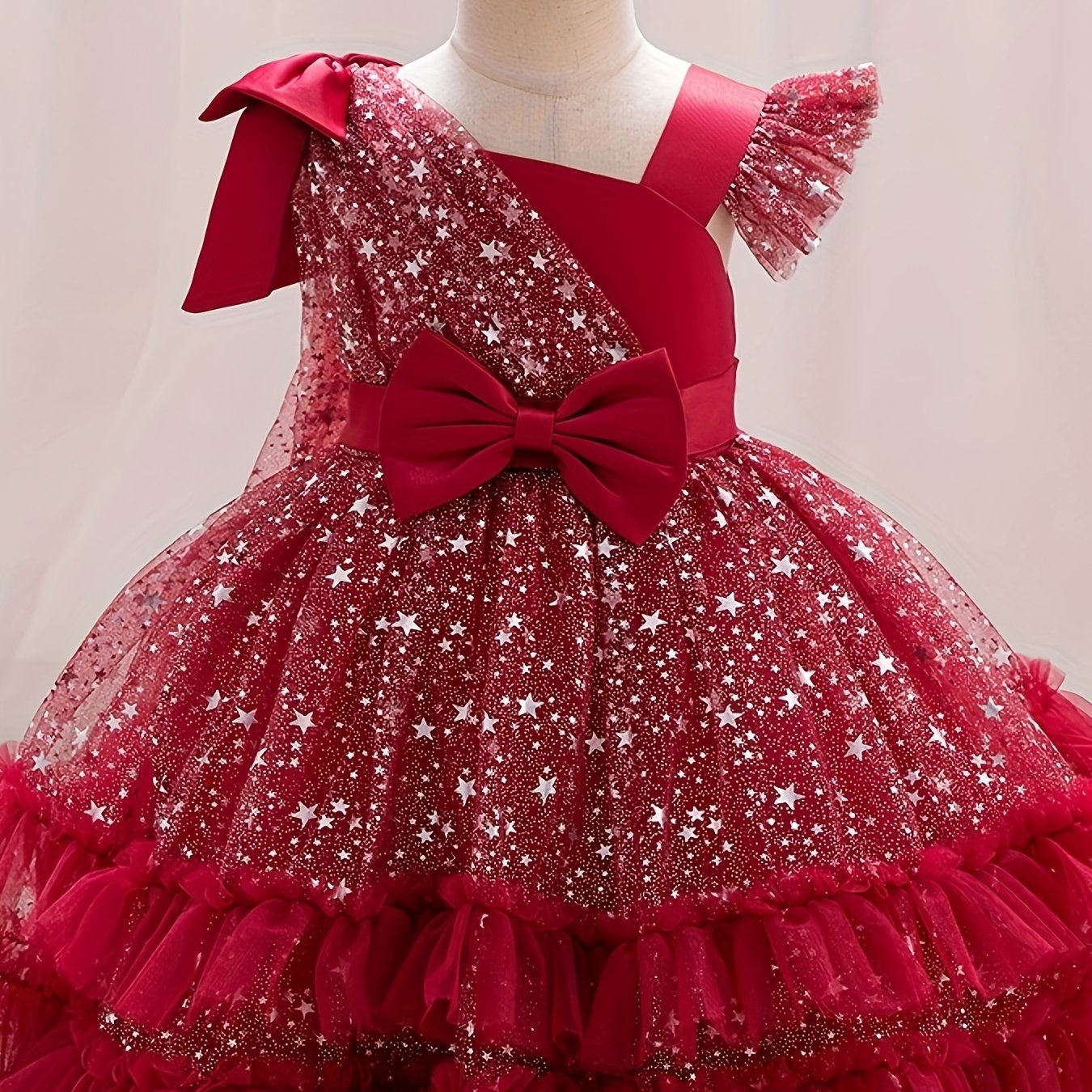 Princess dress for girls with one-shoulder ruffle sleeves, sparkling sequins, and a fluffy design, ideal for weddings, birthdays, and parties.