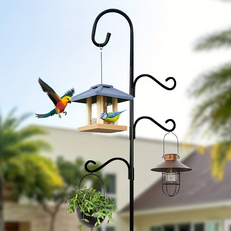 Outdoor iron shepherds hook with three hanging arms and a five-prong base for rust-resistant garden decor. Perfect for hanging bird feeders or flower baskets as a festive decoration.