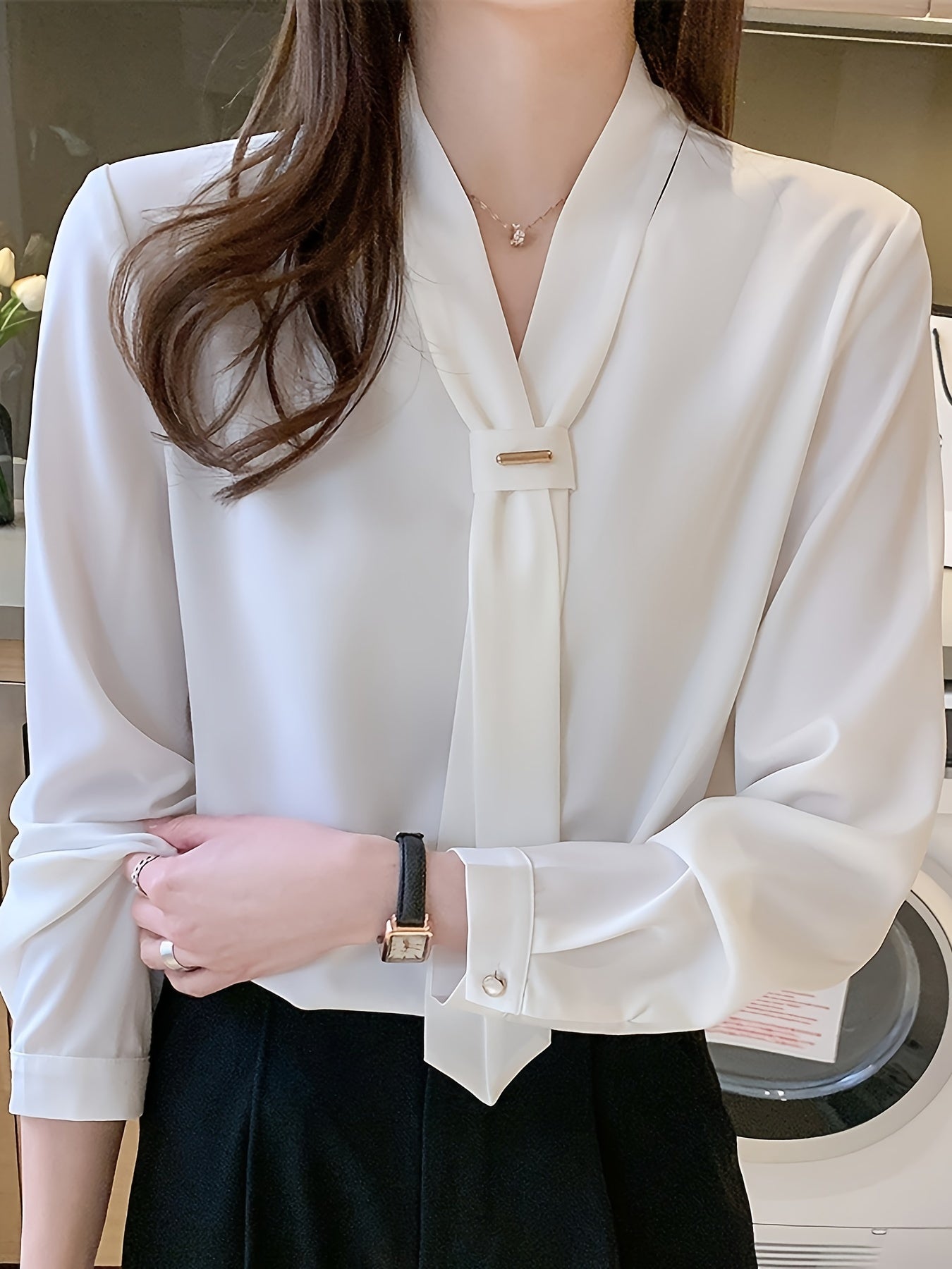 Slimming white chiffon blouse with tie-neck design, perfect for work or casual wear.