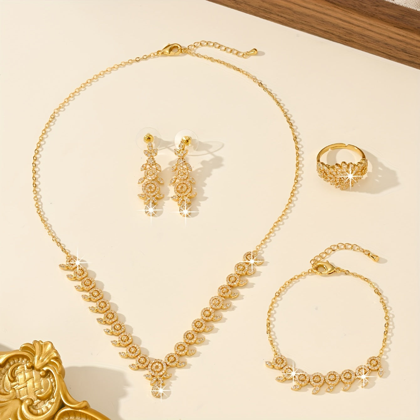 Luxurious Floral Jewelry Set featuring 5 pieces, made with 18K Gold Plated Copper, adorned with Synthetic Zirconia stones in a Leaf and Teardrop design. This set includes a Necklace, Bracelet, Earrings, and an Adjustable Ring, perfect for Women to wear