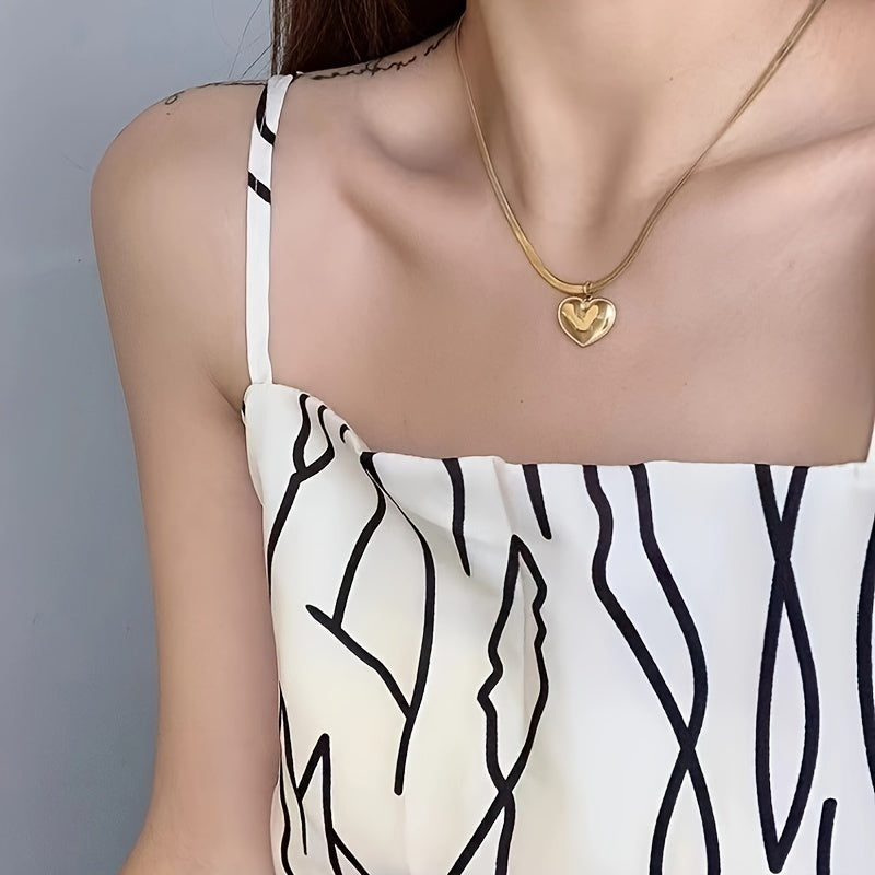 Stylish Heart Pendant Snake Chain Necklace for Women, featuring 18K Gold Plating and sleek 316 Stainless Steel. Perfect for everyday wear or as a thoughtful gift. This necklace does not have any stone inlay.