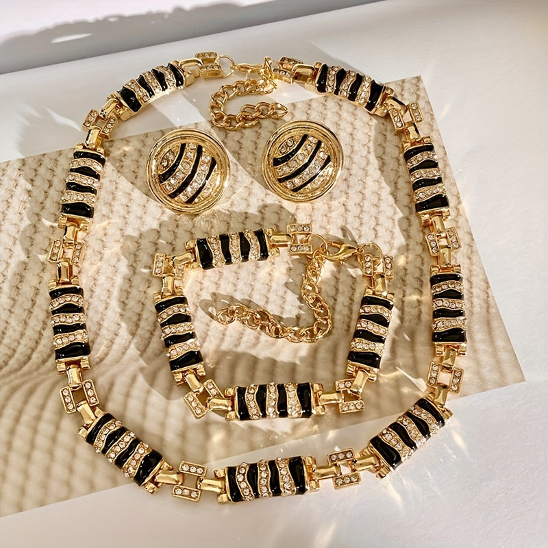 Chic and Stylish French-Inspired Zebra Print Jewelry Set - Featuring Vintage Geometric Design in Gold Plated Enamel with Sparkling Rhinestone Details. Complete with Necklace, Bracelet, and Earrings; Ideal for Everyday Wear, Events, and Celebrations.