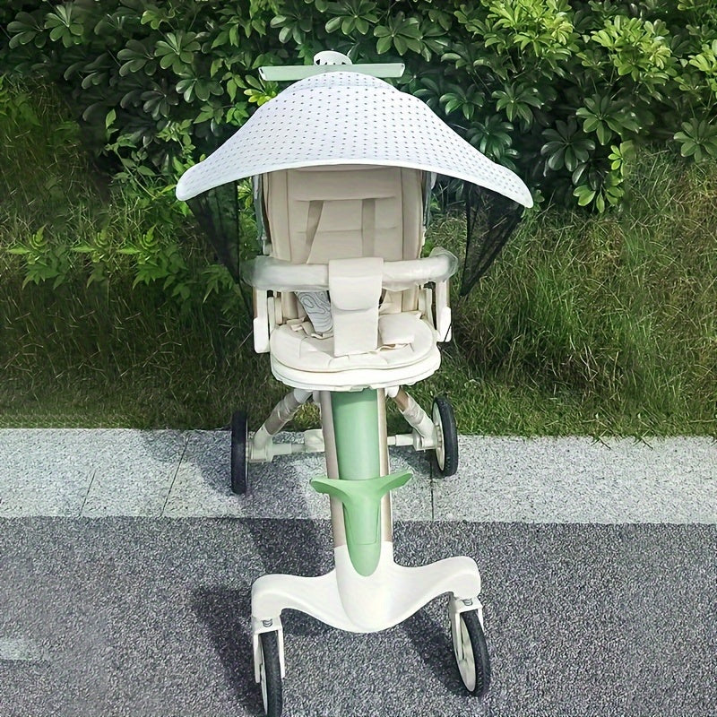 Detachable stroller sunshade shields from wind and UV rays.