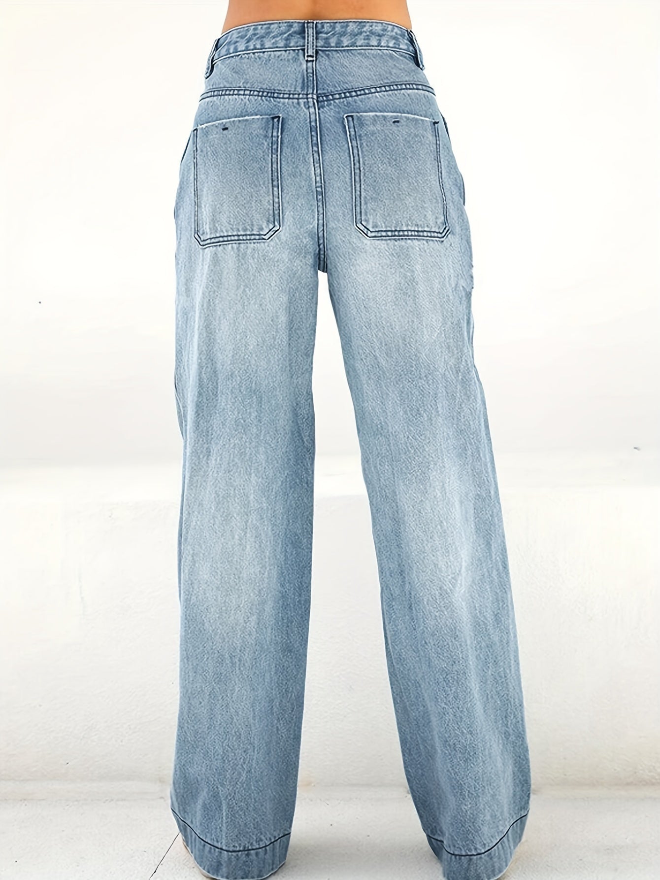 Women's wide leg jeans in plain washed blue denim, comfortable and classic design.