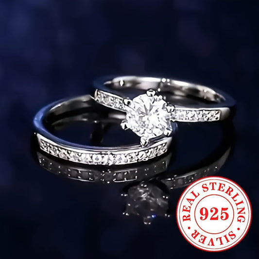 Two elegant sets of sterling silver rings, weighing 5.7g each. These luxurious rings feature a 6-prong set synthetic zirconia stone, perfect for engagement and wedding bands for women. The rings are designed with the April birthstone in a round cut