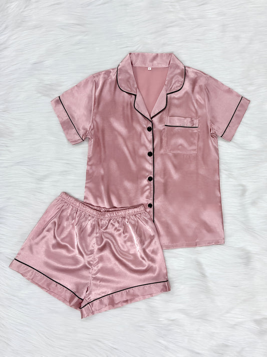 Casual satin pajama set for women with short sleeve top, lapel buttons, and shorts for a comfortable fit.