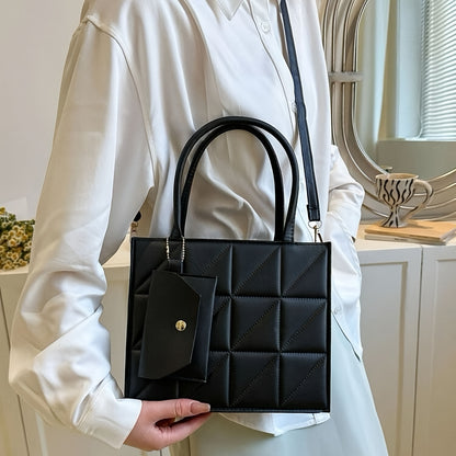 Black quilted synthetic leather tote bag with gold-tone hardware and detachable crossbody strap. Includes matching coin purse. Perfect for work, office, and everyday use. Ideal commuter