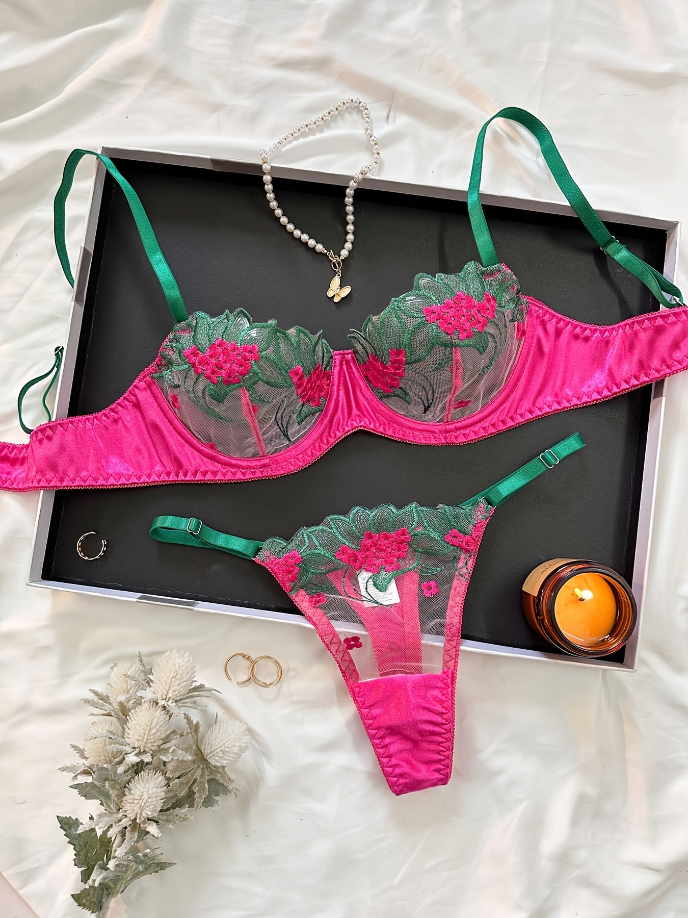 Floral embroidered mesh lingerie set for adult women, made of 95% polyester and 5% elastane.