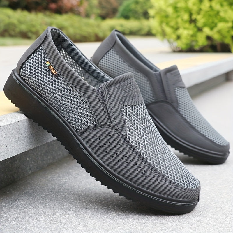 Men's slip-on sneakers with breathable mesh upper, non-slip TPU sole, comfortable fabric insole, solid black design with hook & loop fastener for all-day comfort.