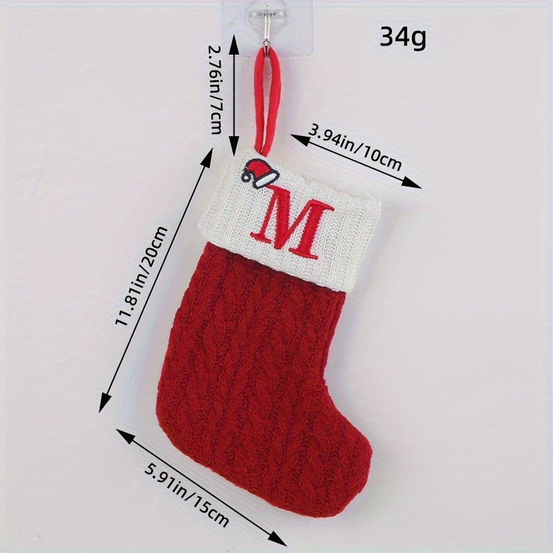 Knitted letter Christmas socks for home tree ornaments; red socks in gift bag for festive attire.