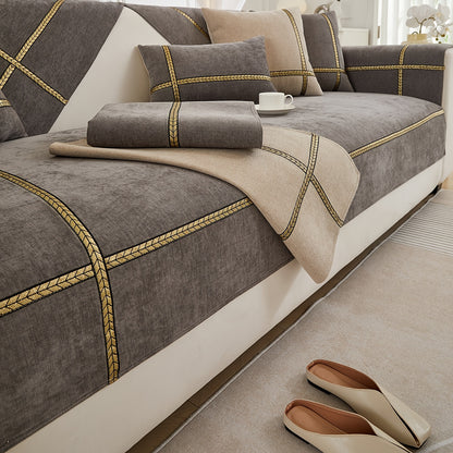 Elegant gray chenille sofa cover with golden braided trim. Non-slip, pet-friendly, and fits single to four-seater sofas. Perfect for all-season use as an elegant home decor in the living room.