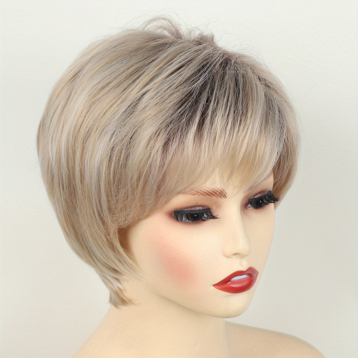 Stylish short pixie cut wig for women with loose wave style, side bangs, and rose net cap. Made of high temperature fiber, suitable for daily and party use.