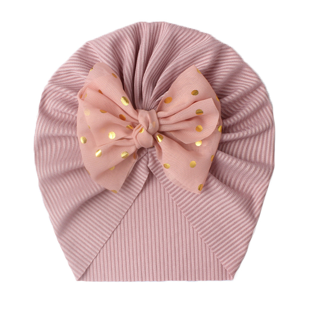 Polka dot printed bow head wrap for newborn infants and toddlers.