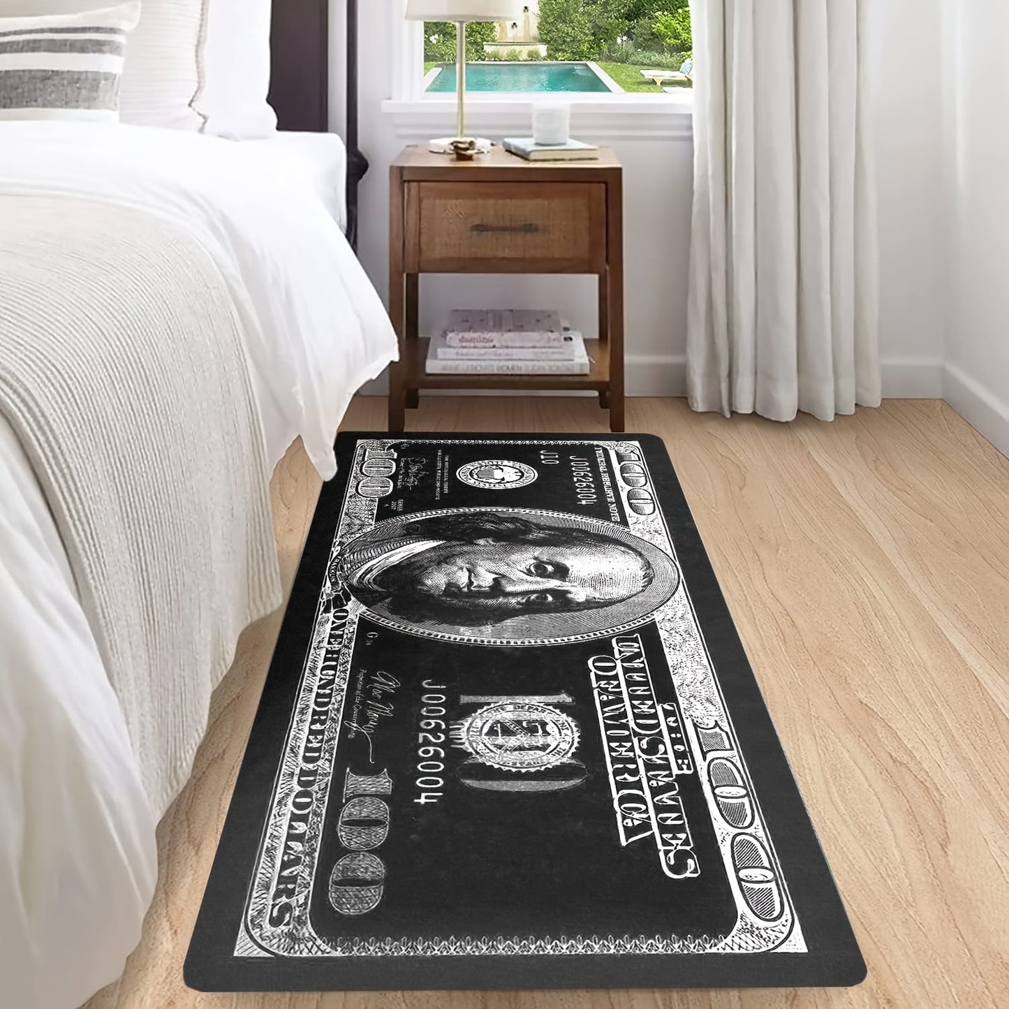 Transform your hallway with this stylish 1-piece Dollar Bill Runner Carpet in black and white. Perfect for adding a modern touch to your kitchen decor or bedroom, this non-skid rug is sure to enhance your home's ambiance.