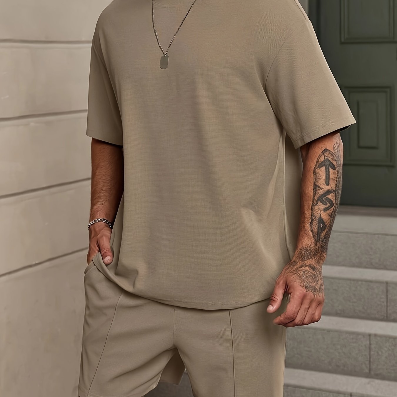 Men's 2-piece solid color summer outfit set includes short sleeve crew neck t-shirt and elastic waist shorts with pockets.