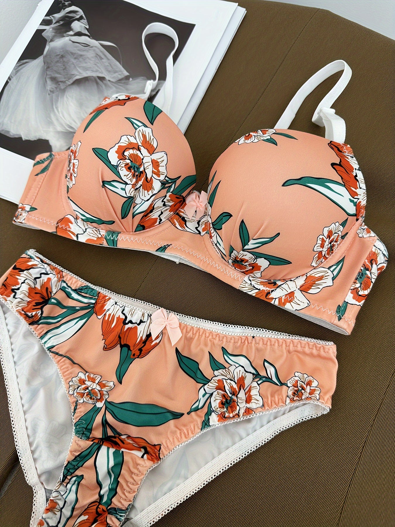 Floral bra and panty set with steel underwire and breast enhancement feature for women.