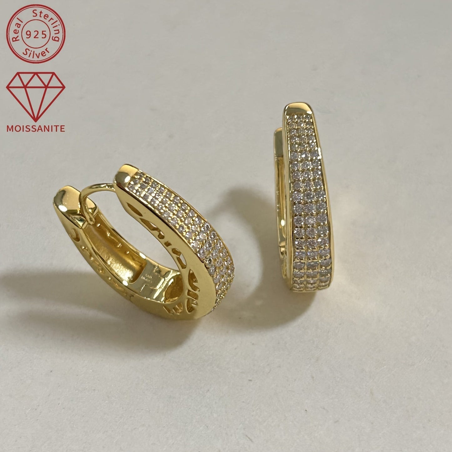 These exquisite women's fashion earrings are made entirely of Moissanite and weigh 8.03g. They feature a stunning pattern of 1.4mm, 1.2mm, 1mm, and 0.8mm Moissanite stones, as well as two 0.43ct Moissanite stones. Crafted in 925 silver, this pair of