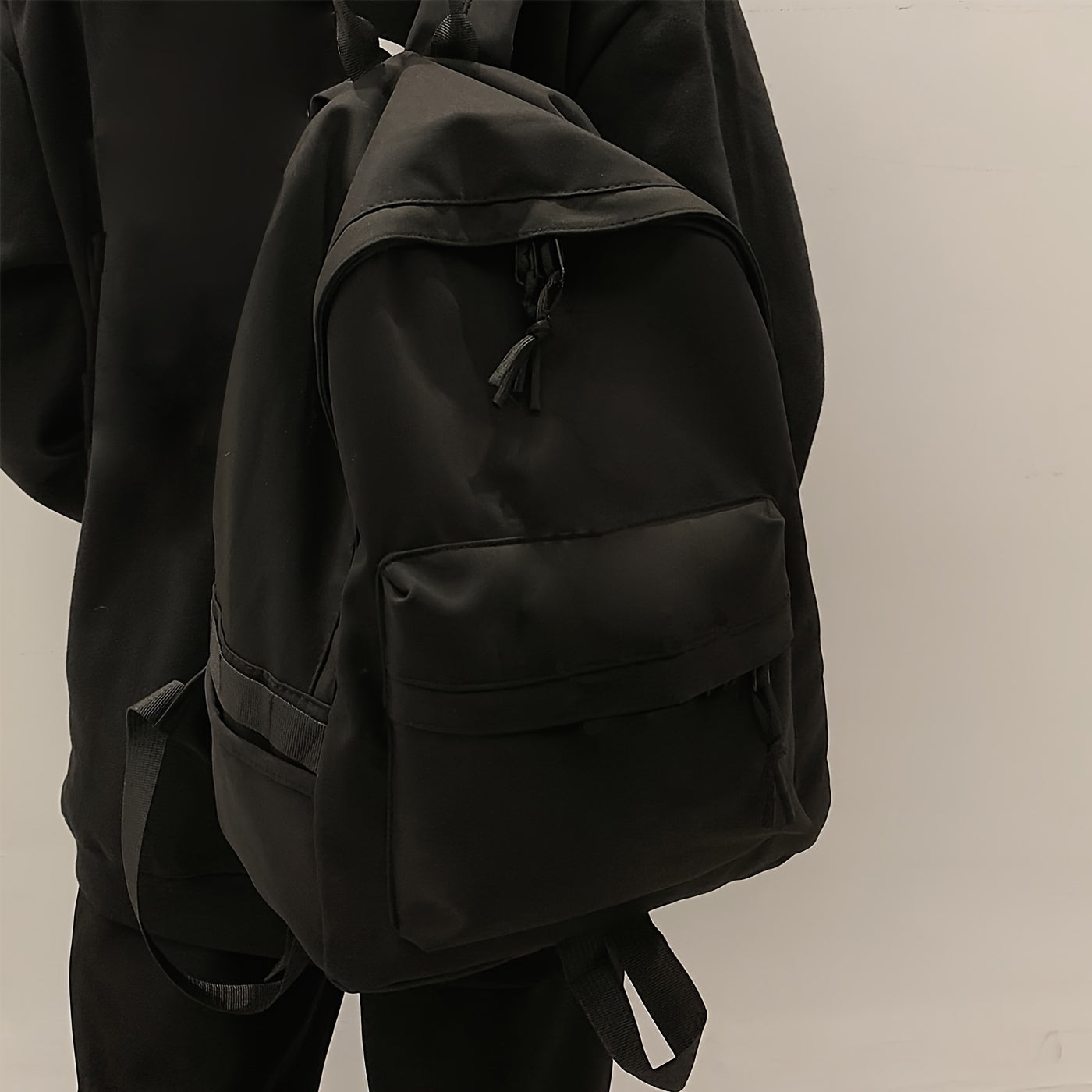 Simple preppy style backpack suitable for school or outdoor activities, lightweight and casual.