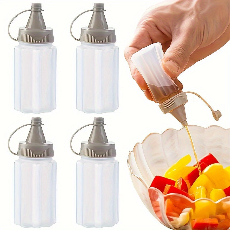 Set of 4 mini transparent seasoning bottles with gray lids, made of food-grade plastic for sauces and dressings. Portable and reusable squeeze containers for BBQs and kitchen use, hand-wash only.