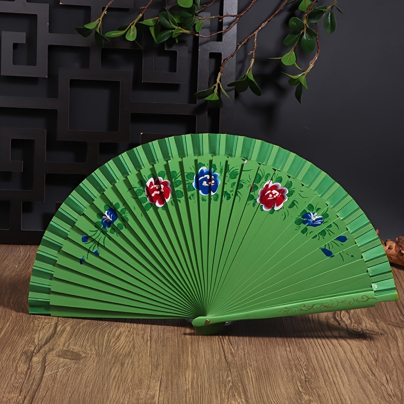 Wooden Spanish folding fan for dancing and home decoration with printed design, conveniently folds for easy storage.