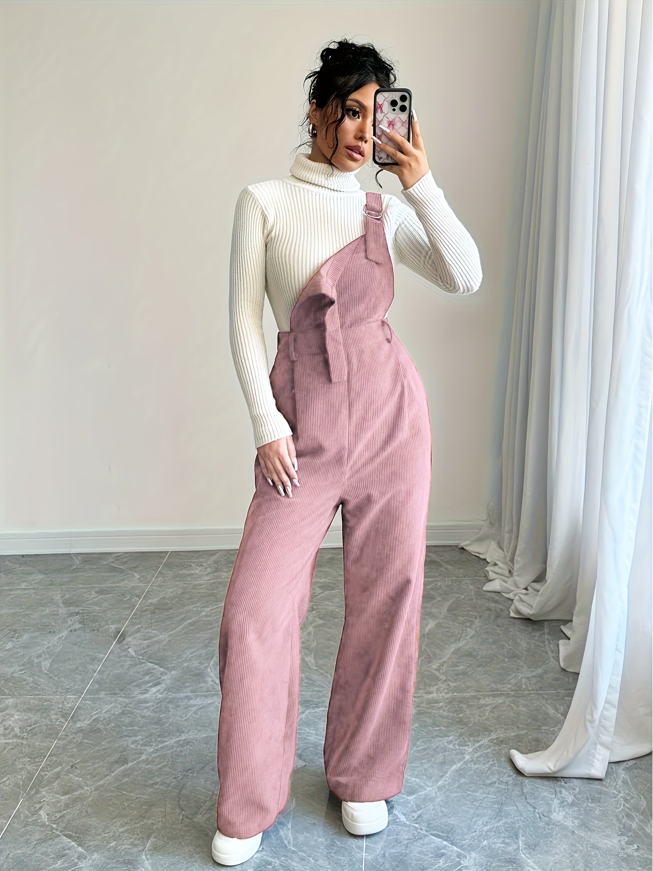 Spandex polyester jumpsuit for women with wide straps and button details, perfect for fall and winter.