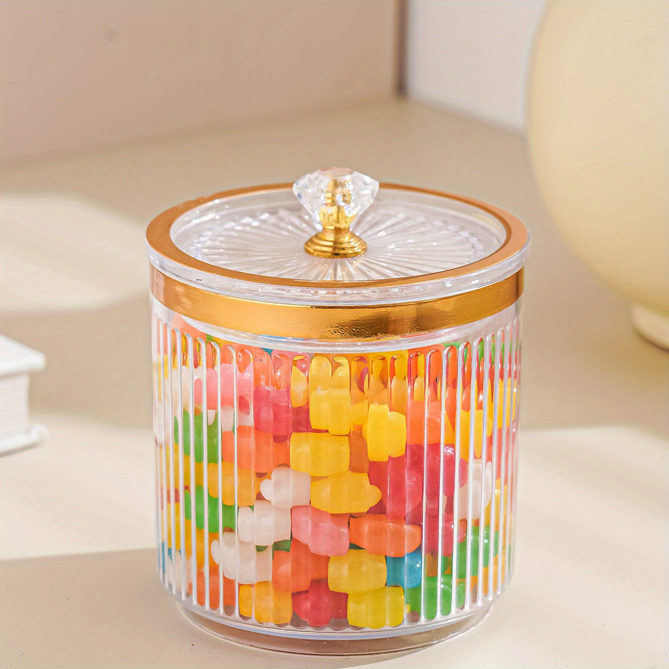 One piece of a transparent amber sketch golden grey bead decorated jar with a lid for candies. Made of plastic, can only be hand washed. It is a reusable sealed fresh-keeping box for storing cereal, rice, pasta, tea, nuts, and coffee beans. Perfect for