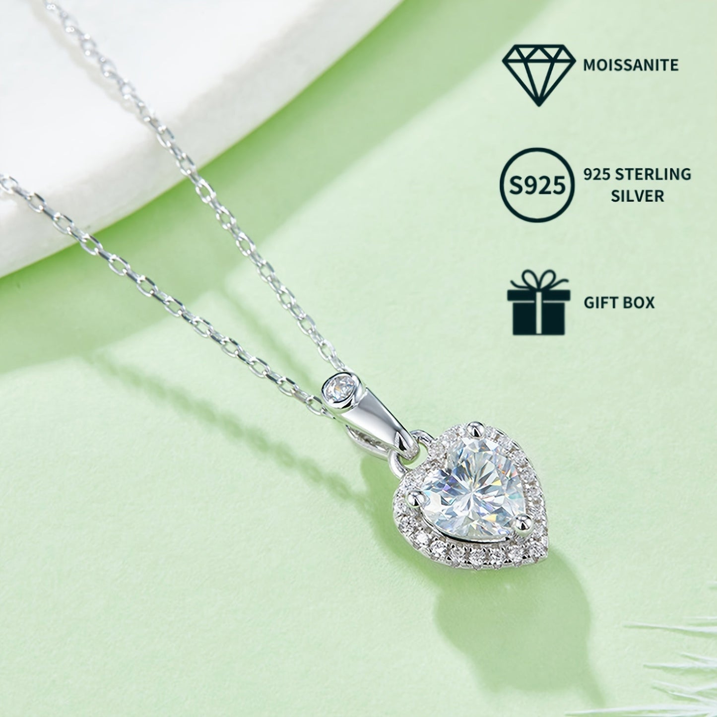 A set of elegant women's jewelry includes a pair of heart-shaped s925 silver earrings featuring 0.5ct*2 moissanite stones, a 1.0ct moissanite pendant necklace, and a matching necklace chain. The set weighs 2.88g for the necklace and 1.58g for the