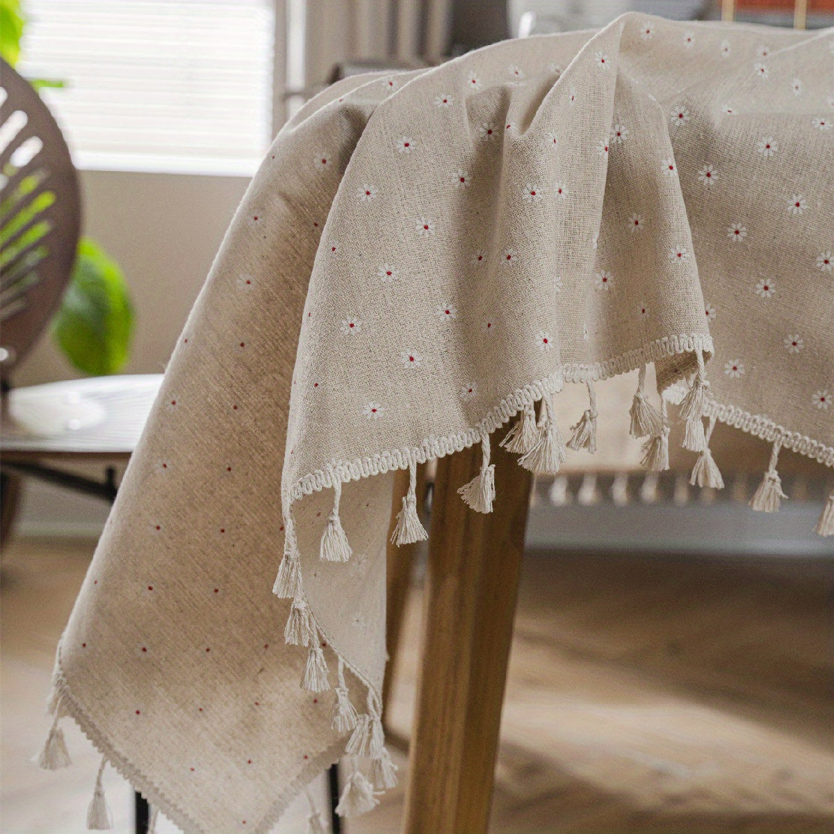 White chrysanthemum and beige linen print farmhouse floral tablecloth with tassels, ideal for kitchen and dining decor. Ready for Thanksgiving, made of polyester, rectangular shape.