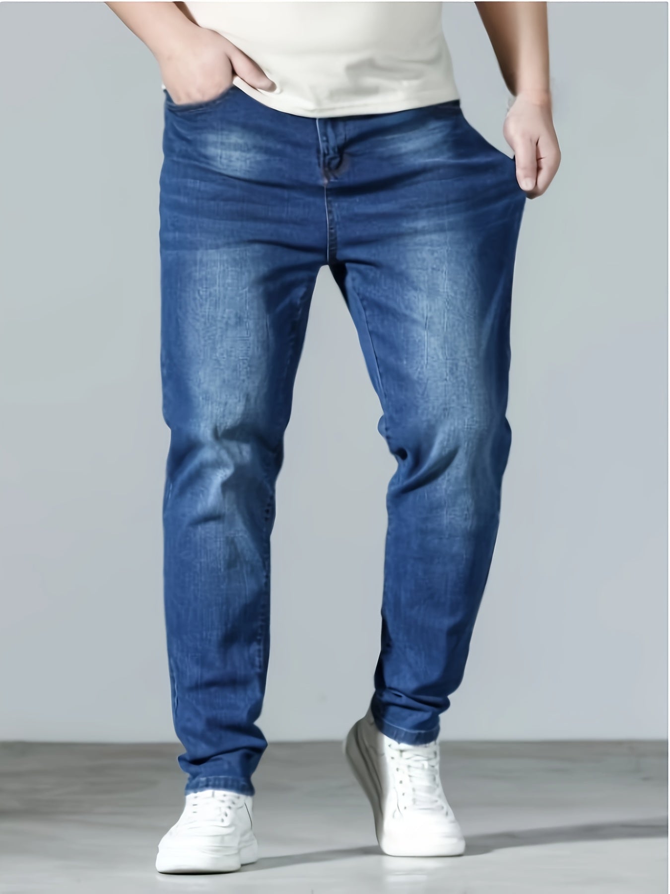 Plus size men's casual skinny fit denim jeans with medium stretch, solid color, pockets, suitable for all seasons.