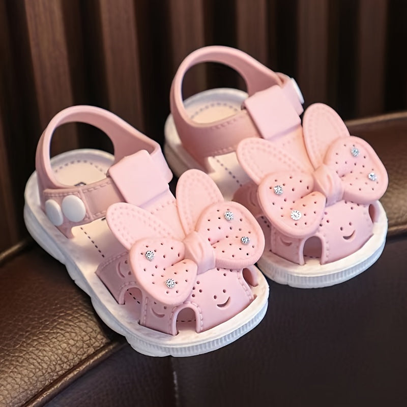 PVC low-top shoes for kids with cartoon and floral pattern, buckle closure, and soft sole.