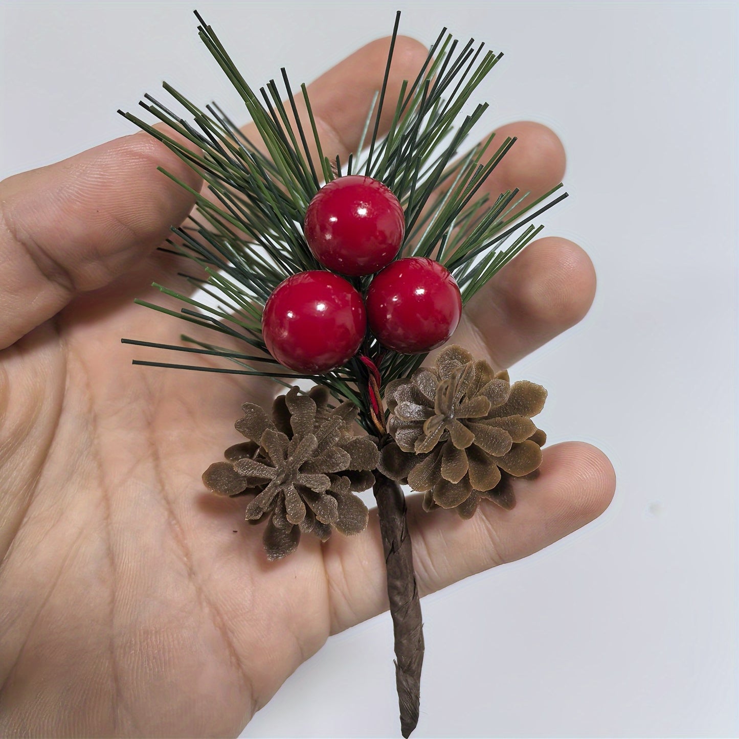 24 artificial pine picks with red berries and pinecones, perfect for DIY wreaths and seasonal decor.