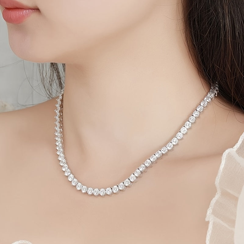 The Moissanite Tennis Necklace by Gems Lady features a 5mm stone set in S925 Sterling Silver with a unique Three-Claw Design. This elegant Clavicle Chain is perfect for all occasions including Engagement, Wedding, Anniversary, Mother's Day, Valentine's